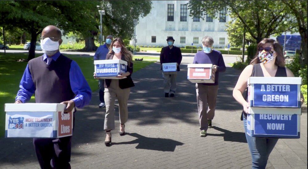 Volunteers deliver boxes containing petitions in favor of legalizing hard drugs
